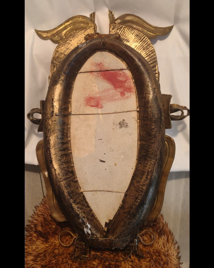 Antique horse-collar mirror detail — aged leather collar with decorative metalwork, Romanian origin