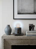 Hidden Ember beeswax candle on handcrafted resin stand — front view | ConelAlma ESP
